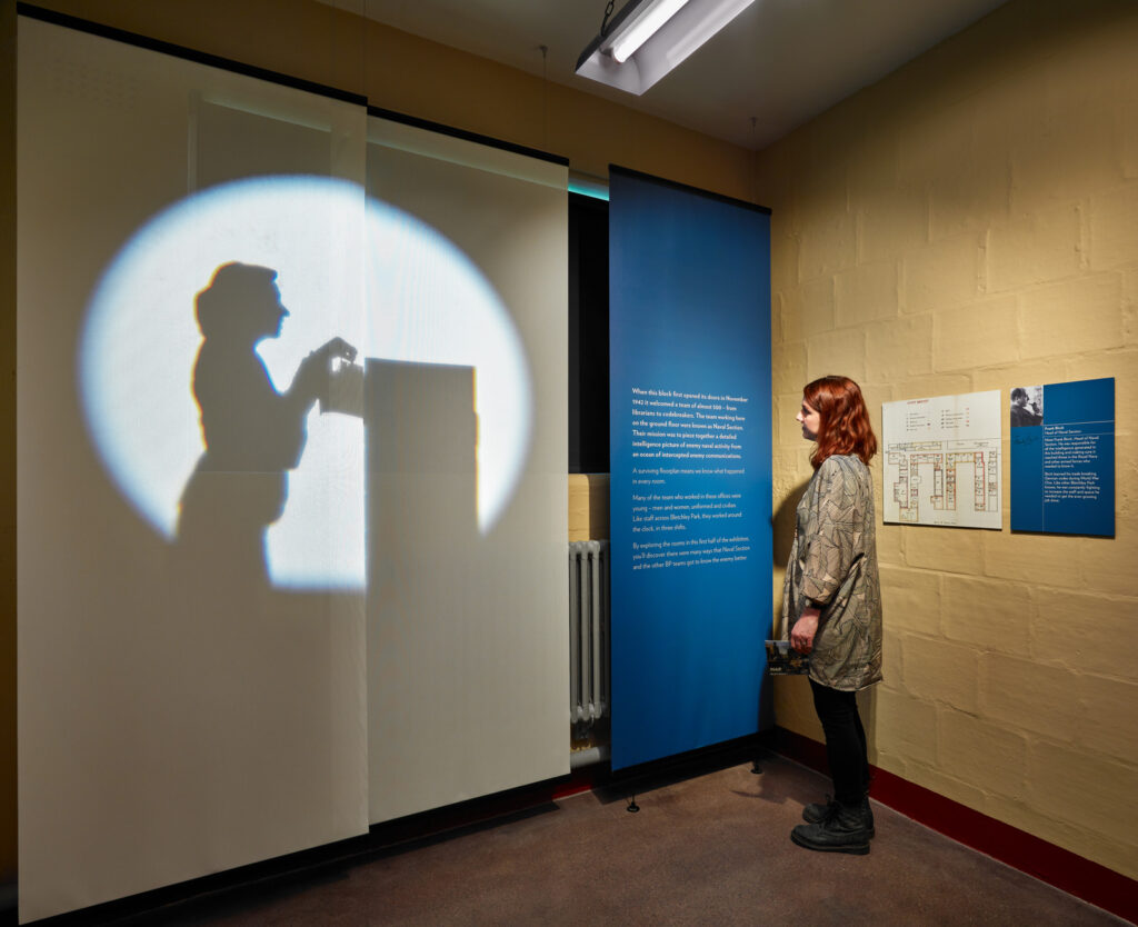 Lighting design enhances The Intelligence Factory, seamlessly illuminating artefacts and narratives for an immersive exhibition.