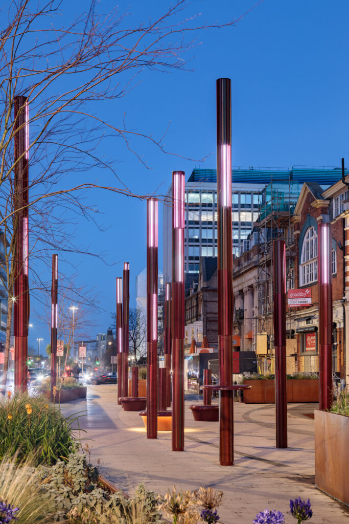 street light columns with integrated speaker system on the street, designed for immersive lighting experience