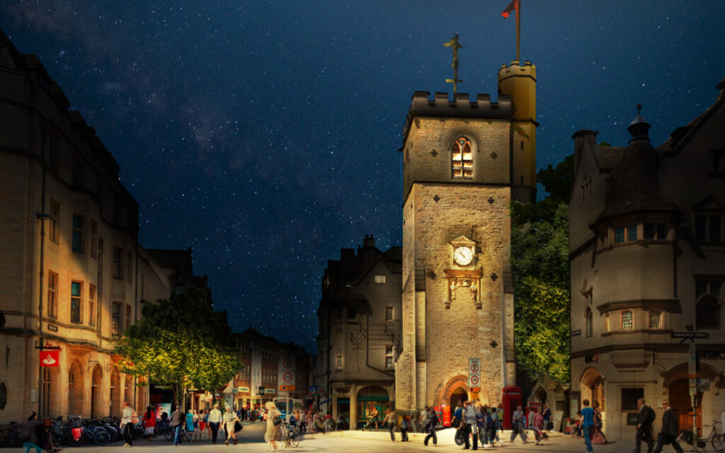 A nighttime view of Oxford city centre showing key architectural landmarks softly illuminated by the new urban lighting strategy. Spires, towers and facades glow with warm white lighting, enhancing the city’s historic character while improving wayfinding and public safety. Designed by Michael Grubb Studio, the lighting scheme balances heritage preservation with modern sustainability in a landmark architectural lighting project.