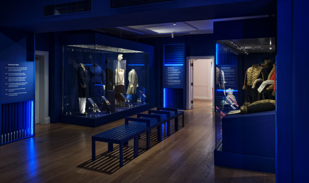 Exhibition lighting from Michael Grubb Studio for Dress Codes temporary exhibition, balancing object visibility and preservation in Kensington Palace gallery