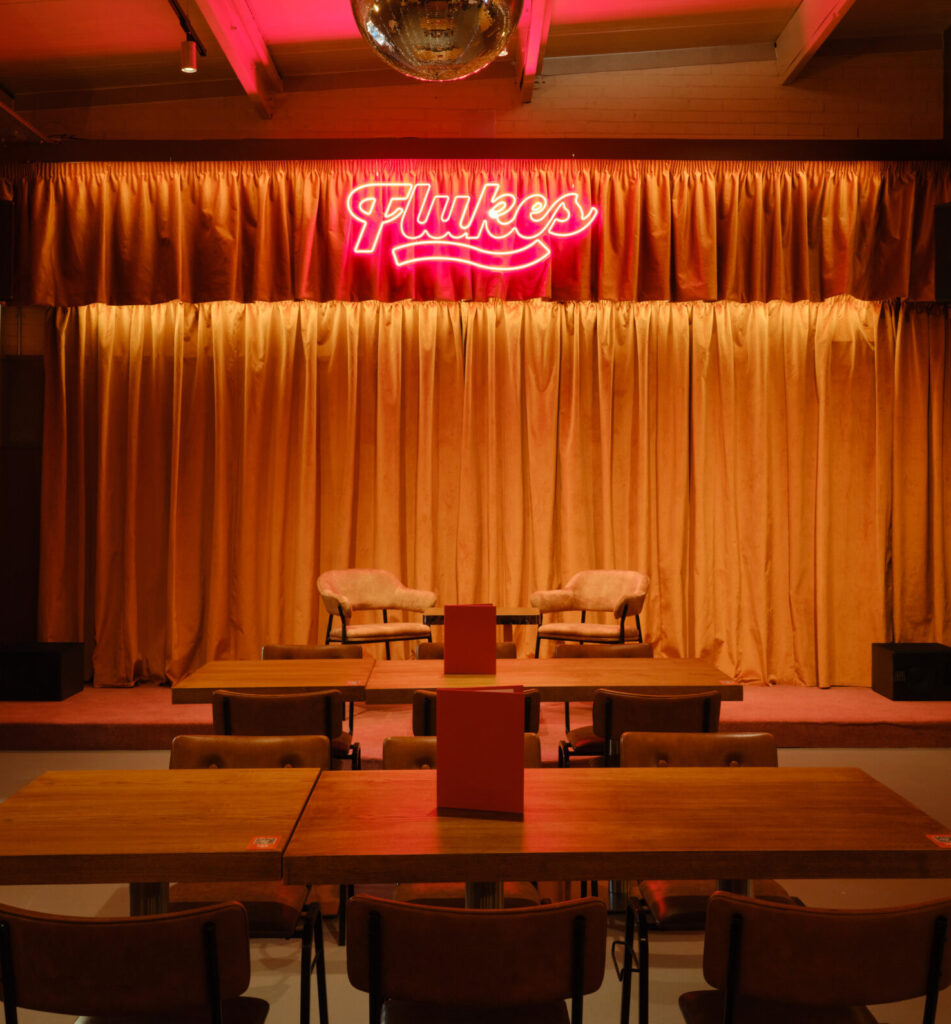 Flukes at Bib Penny Social, interior theatre supported by dramatic and intimate lighting rom international lighting consultants in London, United Kingdom.