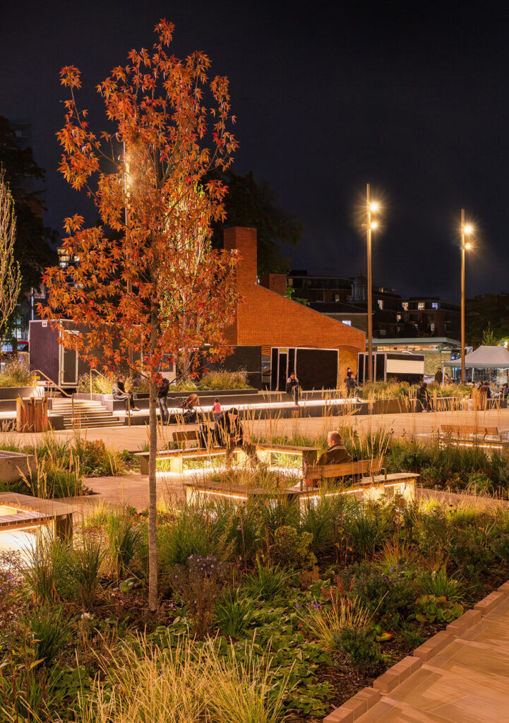 Public realm lighting strategy highlighting planting, seating and heritage architecture for international urban design projects.